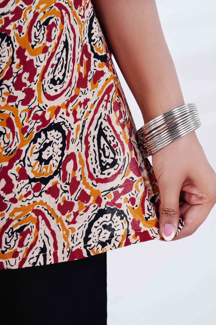 Kalamkari Soul: Earth-Toned Paisley Kurti with Peacock Long Jhumkas