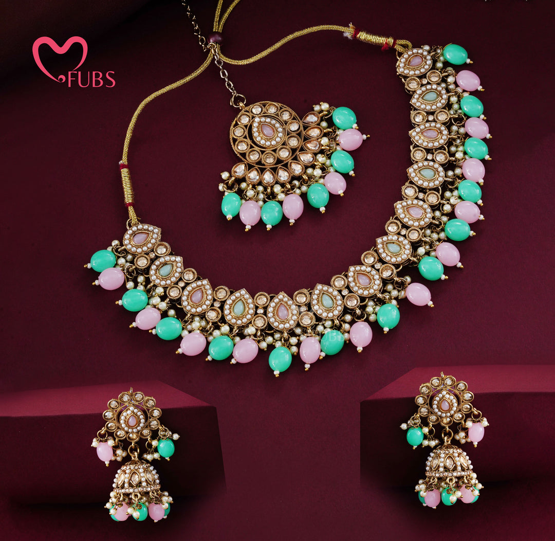 Artisanal Floral Motif Gold-Finish Necklace Set with Jhumka Earrings & Maang Tikka