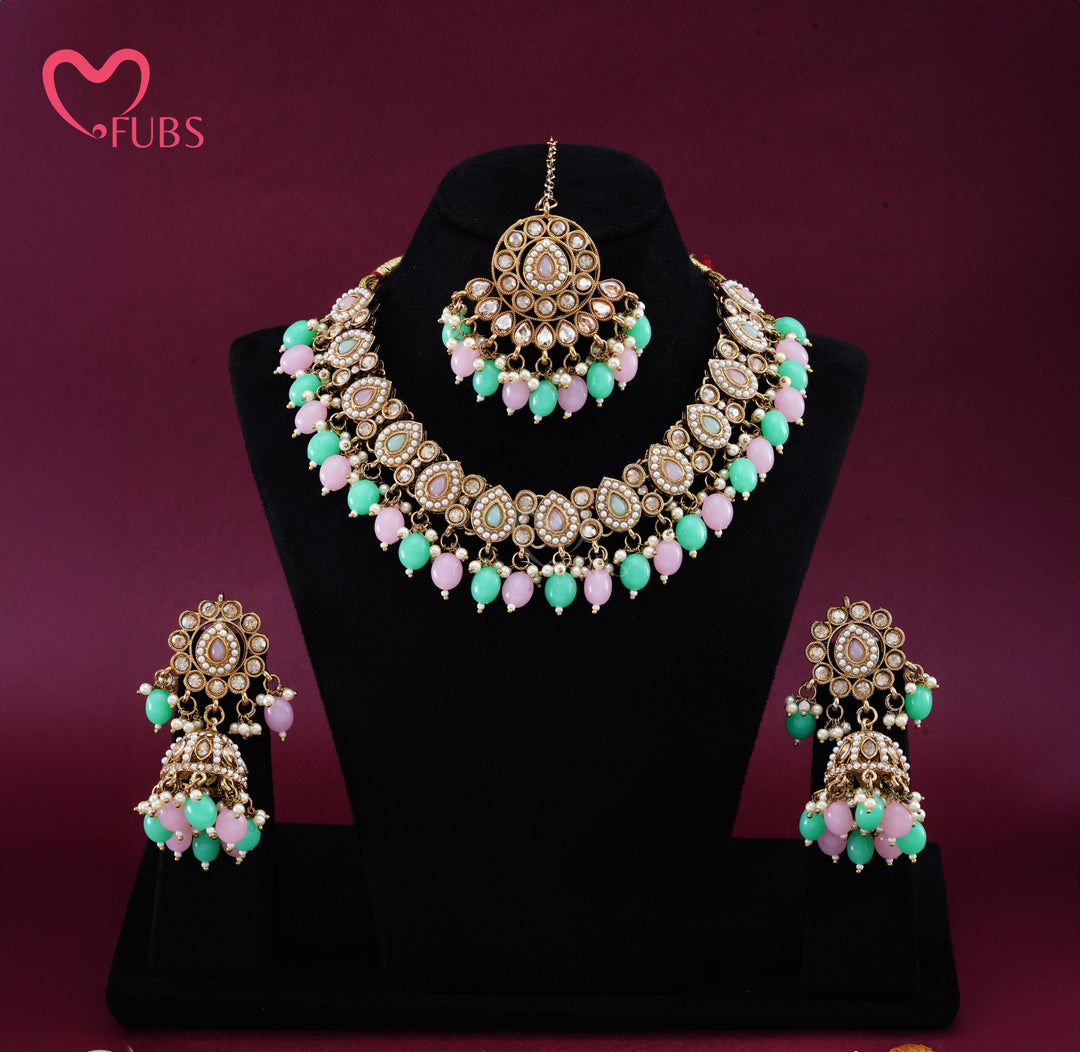 Artisanal Floral Motif Gold-Finish Necklace Set with Jhumka Earrings & Maang Tikka